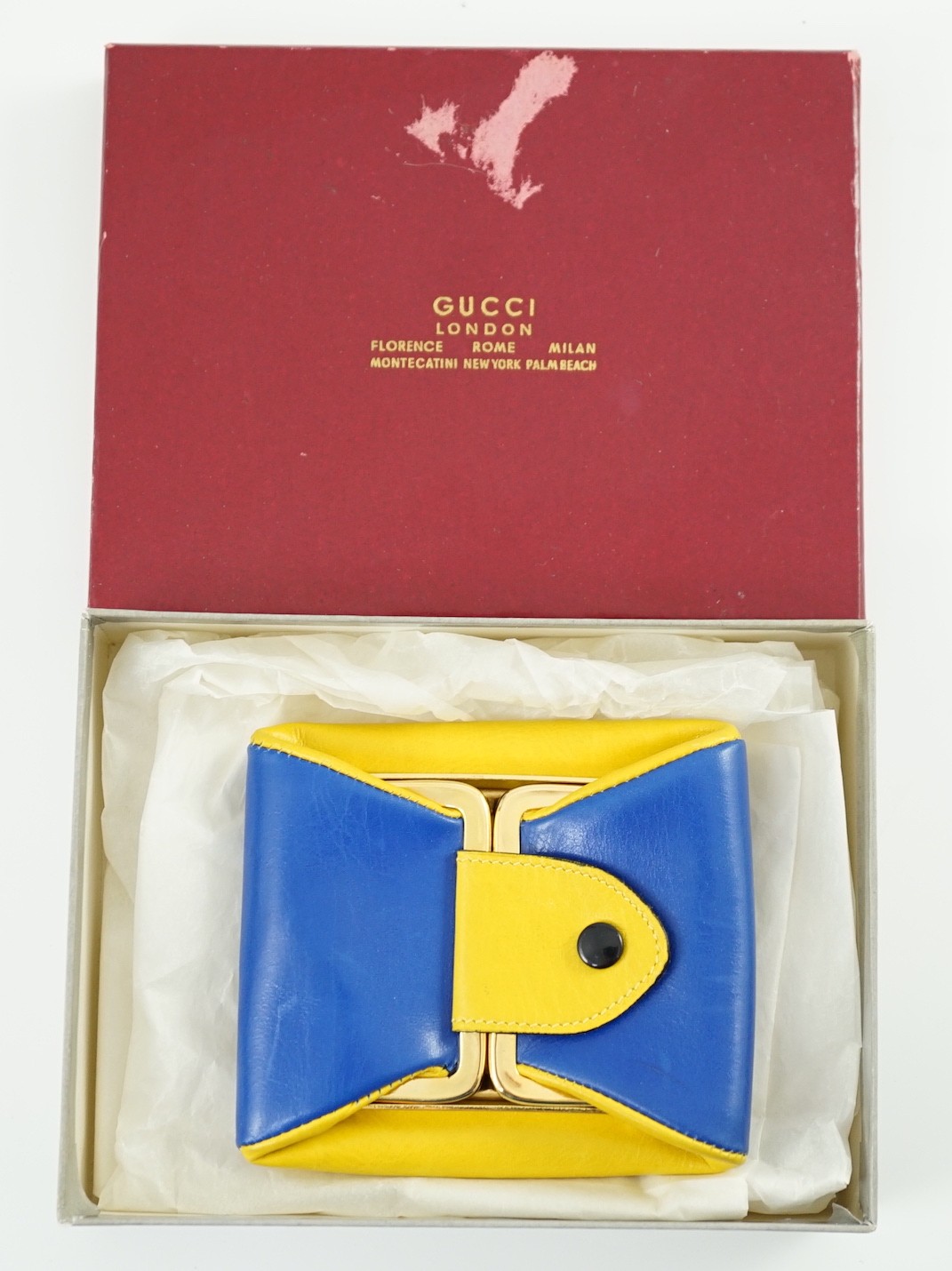 A boxed Gucci yellow and blue leather purse, 9 cm.